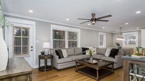 A living room with a gray sectional sofa, a coffee table, and a ceiling fan. - 100% - 5 STAR reviews!   Legendary Getaway! (Township of Taylorsville)