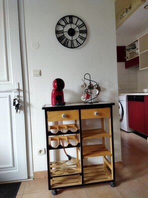 Prepare meals and do laundry in this kitchen with a washing machine and ample storage.