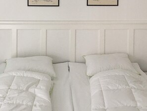 A room with two beds, each with white bedding and pillows. - 5 Star Holiday Home in Nakskov (Nakskov)
