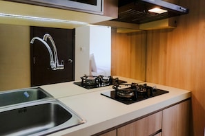Private kitchen - Good Deal Studio Room at Harvard Jatinangor Apartment (Hegarmanah)