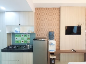 Studio | Private kitchen | Full-sized fridge, stovetop - Minimalist Studio At Vivo Apartment (Depok)