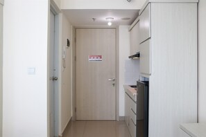 Studio | Private kitchen | Full-sized fridge, stovetop - Full Furnished With Simply Look Studio At Springlake Summarecon Bekasi Apartment (Bekasi)