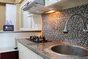 Apartment | Private kitchen | Full-sized fridge, stovetop, rice cooker, cookware/dishes/utensils - Fancy And Nice 2Br Apartment At Green Pramuka City (Jakarta)