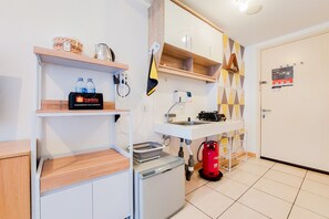 Studio | Private kitchen | Full-sized fridge, stovetop - Strategic And Nice Studio Apartment At M-Town Residence Travelio (Gading Serpong)