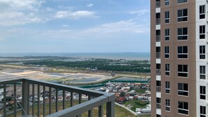 A high-rise building with multiple floors and balconies. - Relaxing And Warm 2Br At Tokyo Riverside Pik 2 Apartment (Teluknaga)
