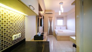 Private kitchen - Compact And Comfy Studio At Puri Mas Apartment (Surabaya)