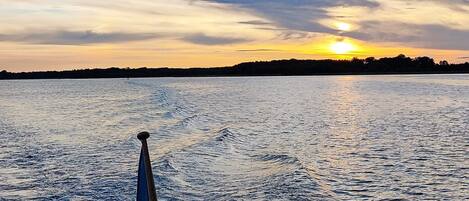 A body of water with a wake pattern indicating movement, likely from a boat.