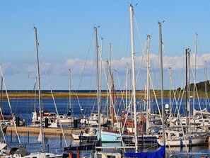 A marina with multiple sailboats docked. - 5 Star Holiday Home in Wendtorf (Wendtorf)