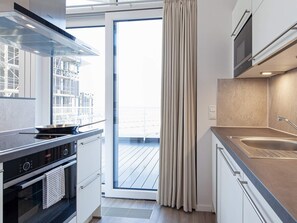 Apartamento | Cozinha privada | Geladeira