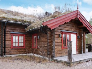 A rustic log cabin with a red roof and a number '16' on the wall. - 4 Star Holiday Home in Salen (Salen)