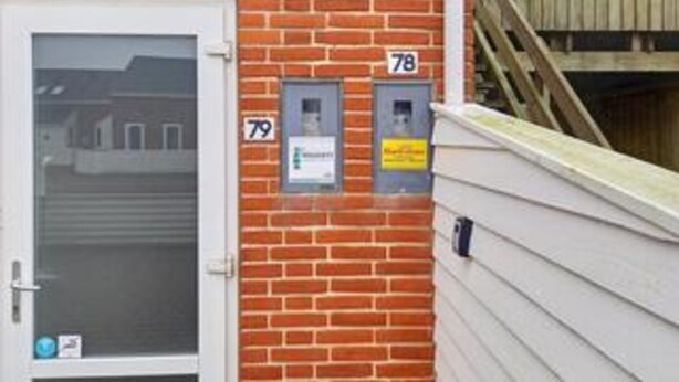 A brick building with a white door and two mailboxes labeled 78 and 79. - 4 Person Holiday Home in Romo (Rømø)