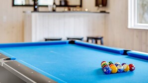 A pool table with a set of billiard balls in the foreground. - 5 Star Holiday Home in Jaegerspris (Jægerspris)