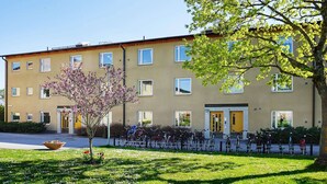 A multi-story building with a flat roof, large windows, and a central entrance. - 6 Person Holiday Home in Visby-by Traum (Visby)