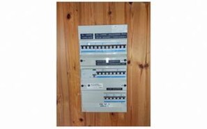 A wall-mounted electrical panel with multiple circuit breakers and switches. - 8 Person Holiday Home in Blavand (Blavand)