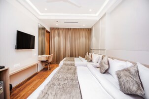 Family Quadruple Room, Courtyard View | Minibar, blackout drapes, soundproofing, iron/ironing board