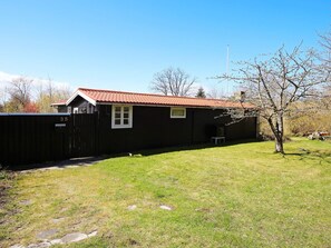 A single-story building with a red-tiled roof, a small window, and a number '35' on the gate. - 4 Person Holiday Home in Jaegerspris (Jægerspris)