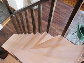 A wooden staircase with a light finish, leading to a carpeted area. - 4 Star Holiday Home in Munka-ljungby (Munka-Ljungby)