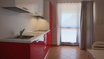 Family Apartment | Private kitchen | High chair, dining tables