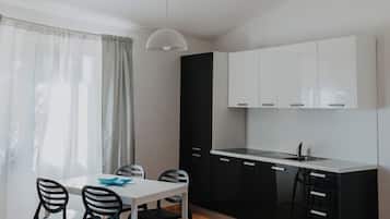 Classic Apartment | Private kitchen | High chair, dining tables