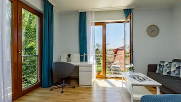 Comfort Apartment | Living area | 80-cm LCD TV with cable channels, TV