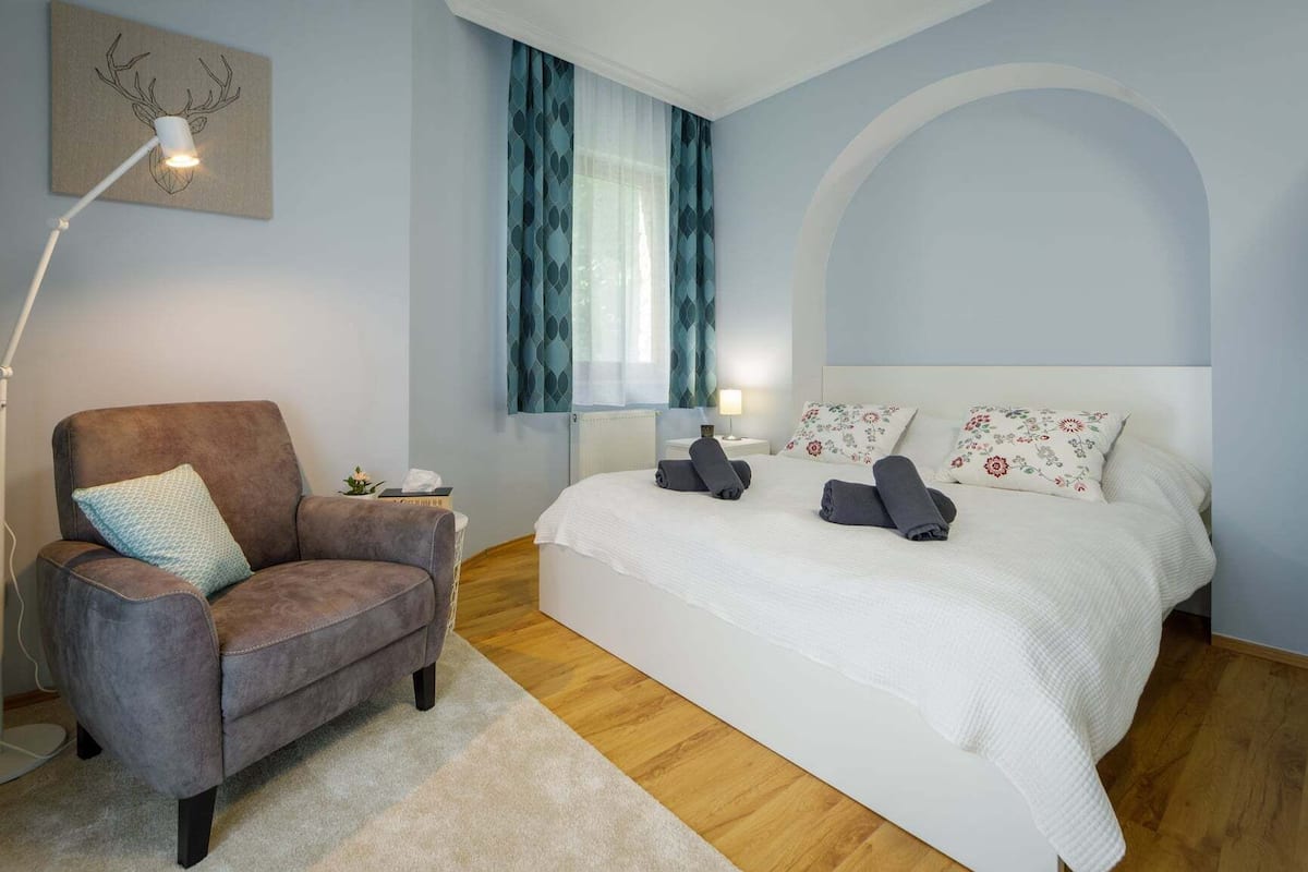 Deluxe Apartment | Living area | 80-cm LCD TV with cable channels, TV