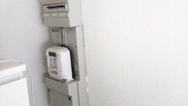 A white electrical panel with a control panel and a meter. - 4 Star Holiday Home in Vig (Vig)