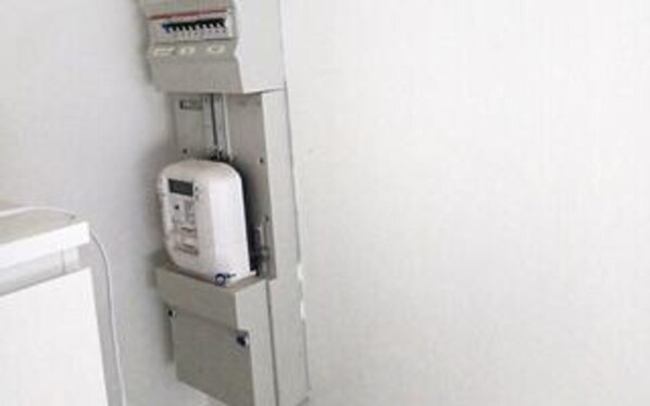 A white electrical panel with a control panel and a meter. - 4 Star Holiday Home in Vig (Vig)