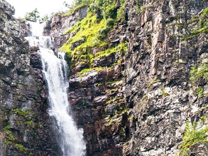 A waterfall cascading down a rocky cliff. - 4 Star Holiday Home in Idre (Idre)