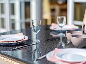 A table set with plates, bowls, and wine glasses, indicating a dining area. - 6 Person Holiday Home in Vejby-by Traum (Vejby)