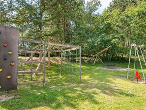 A playground with climbing structures and swings.