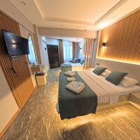 Family Quadruple Room, 1 Bedroom, Non Smoking, Pool View | Premium bedding, free minibar, individually decorated, desk