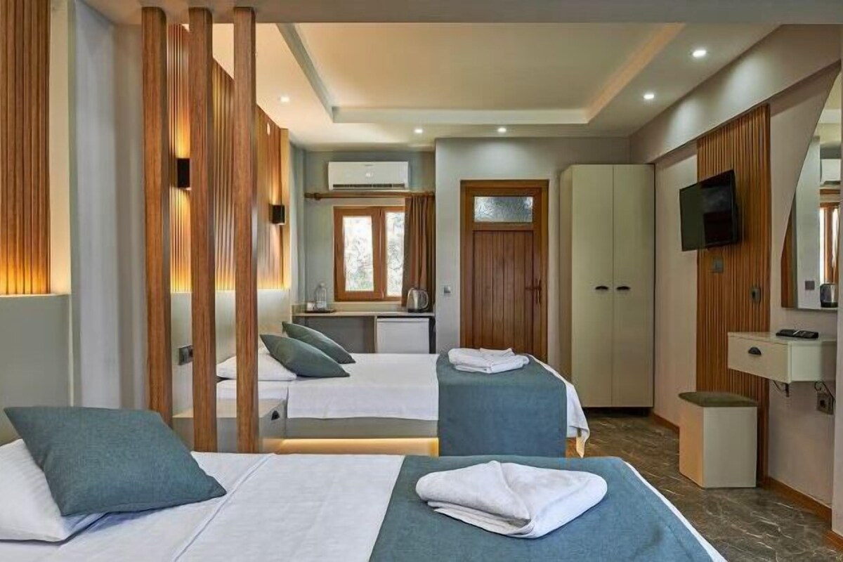 Premium bedding, desk, laptop workspace, blackout drapes