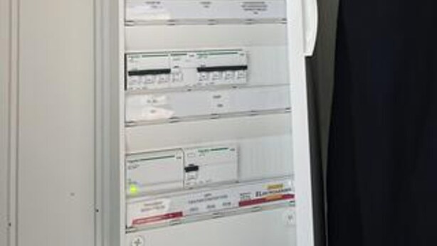 A control panel with multiple switches and indicators, likely for electrical or mechanical systems.