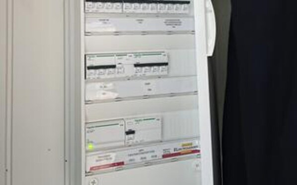 A control panel with multiple switches and indicators, likely for electrical or mechanical systems.