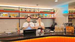 A bar area with shelves of Heineken cans, a coffee machine, and various bottles. - d'primahotel Airport Jakarta Terminal 3 Wellness Center (Tangerang)
