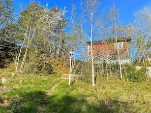 A building surrounded by trees and a clear sky. - 4 Star Holiday Home in Trollhattan (Trollhattan)