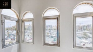 Three arched windows with a marina view. - Marina VIEW APT SLPs 9 with private terrace & BBQ (Ta` Xbiex)