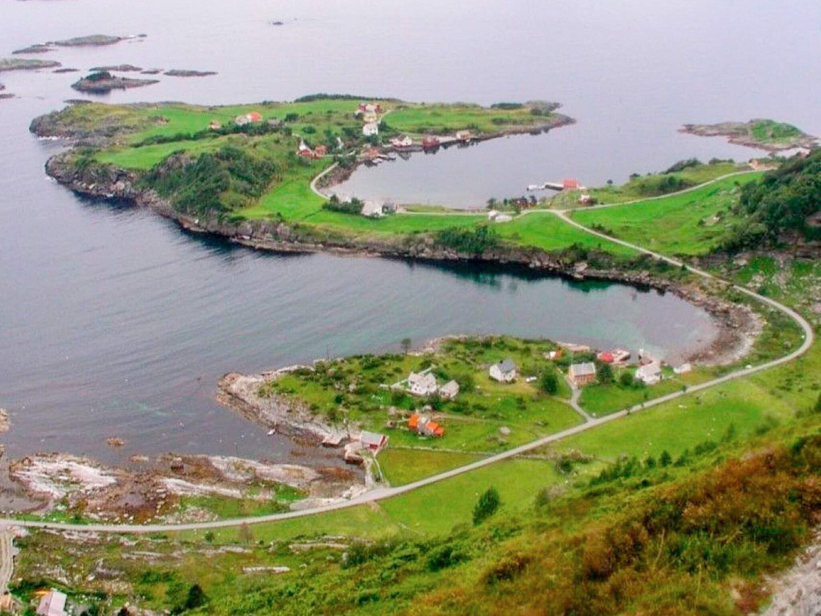 A coastal landscape with multiple small islands connected by a winding road.