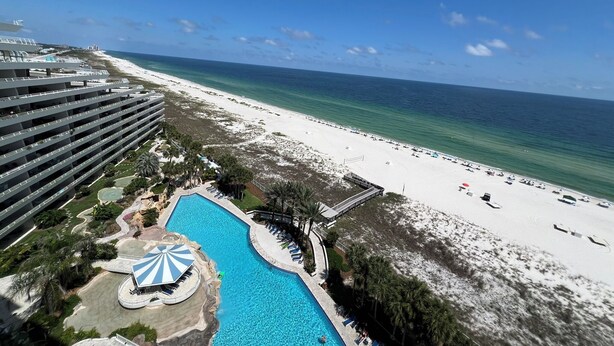 A resort with a large pool, beach, and ocean view. - West 1003 at Eden Condominiums Gulf Front Condo with Stunning Views! (Pensacola)