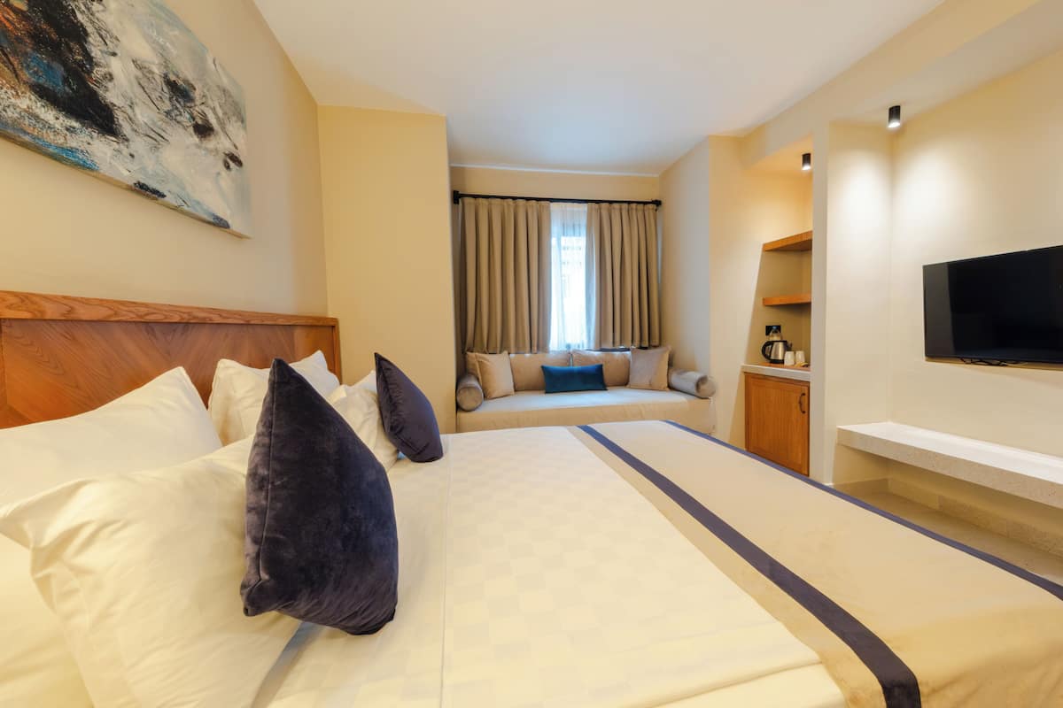 Family Suite | Minibar (free items), in-room safe, desk, laptop workspace