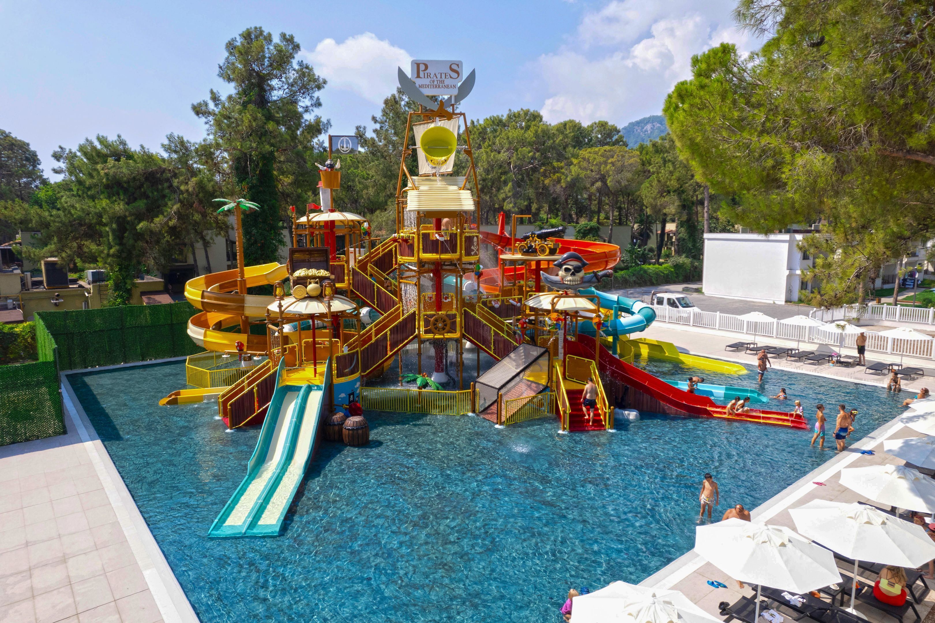 A water park with slides and a pirate-themed play structure.