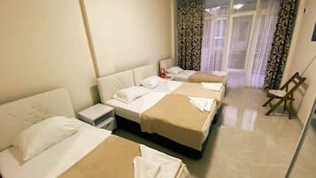 Classic Quadruple Room | Blackout drapes, iron/ironing board, travel crib, free WiFi