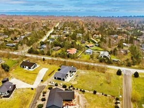 An aerial view of a residential area with houses, roads, and green spaces. - 14 Person Holiday Home in Vaeggerlose (Vaeggerlose)