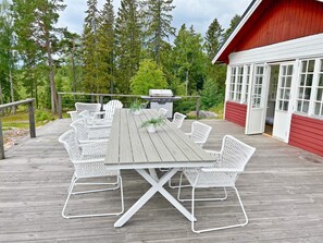 Enjoy meals al fresco at this outdoor dining area with a large table and six comfortable chairs.