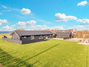 A modern two-story building with a flat roof and a covered outdoor area. - 4 Star Holiday Home in Vinderup (Vinderup)