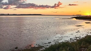 A calm body of water reflecting the sky during sunset. - 5 Person Holiday Home (Vordingborg)