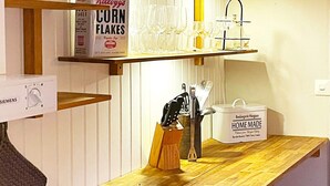 A kitchen counter with a cereal box, a wine glass holder, and a 'Home Made' container. - 4 Star Holiday Home in Gotlands Tofta (Gotlands Tofta)