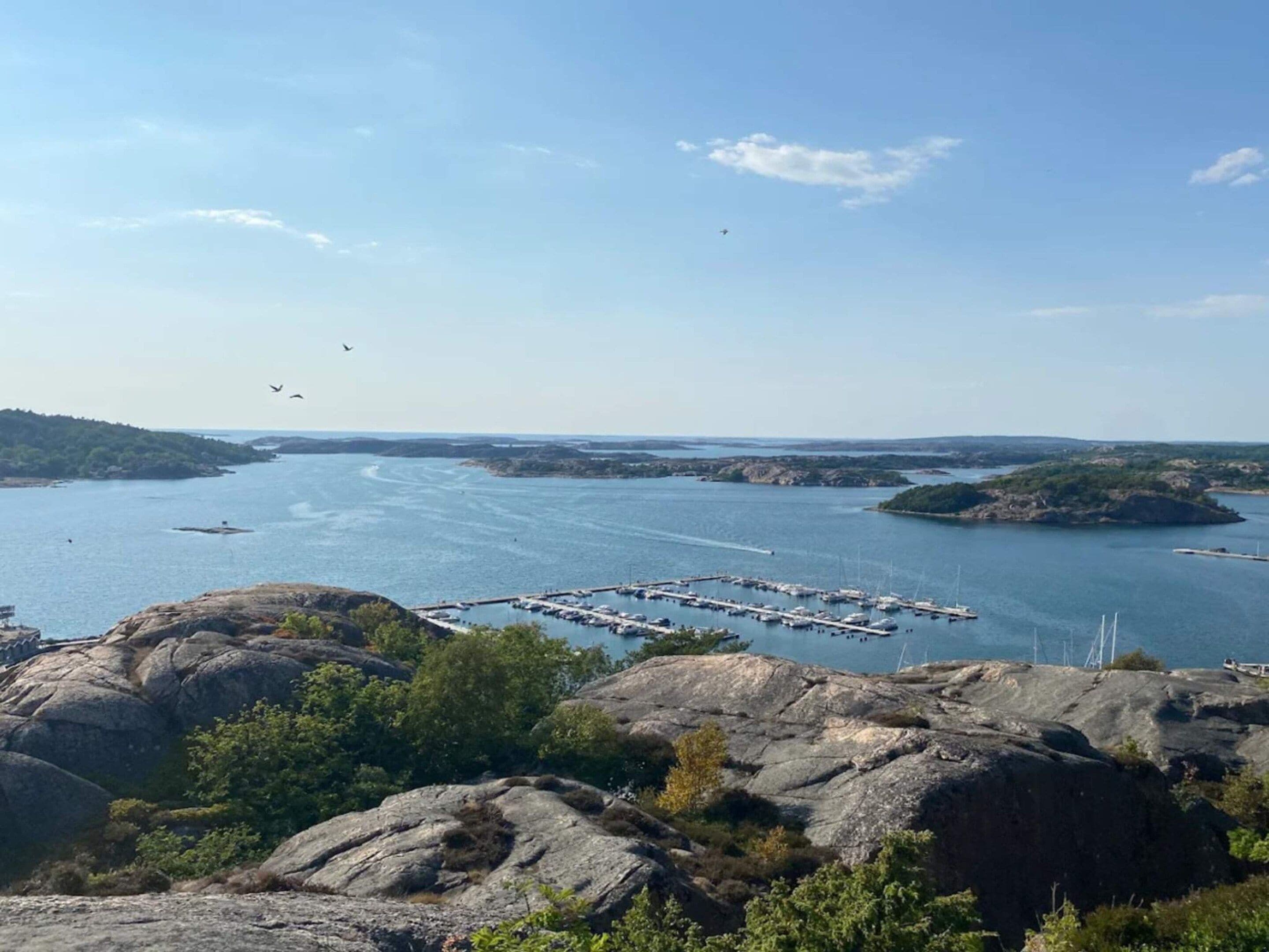 A marina surrounded by rocky terrain and water.