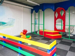A children's play area with colorful play structures and seating. - 4 Person Holiday Home in Hejls (Hejls)