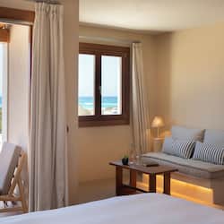 Suite Junior, vista mare | 1 camera, biancheria da letto di alta qualità, minibar